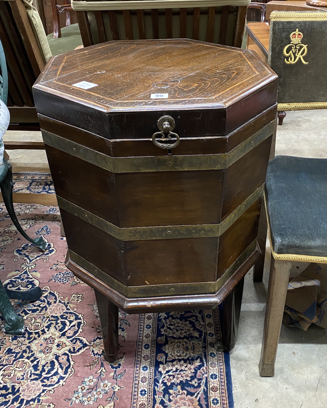 A George III style brass bound octagonal oak cellarette, width 49cm, height 78cm